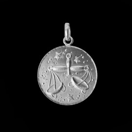 silver zodiac sign medallion